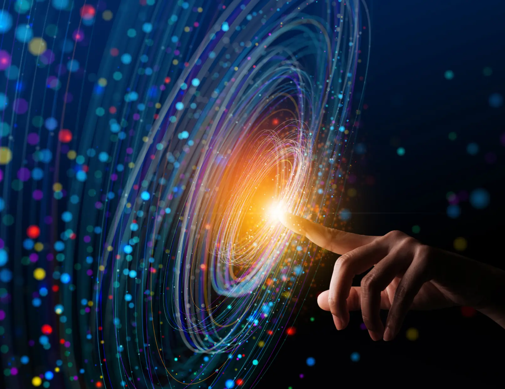 Human finger touching the glowing center of a high-tech array of circular blue and magenta rays of light